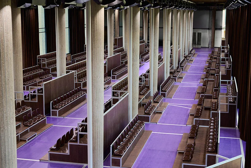 a space with tightly arranged bleachers and a narrow catwalk